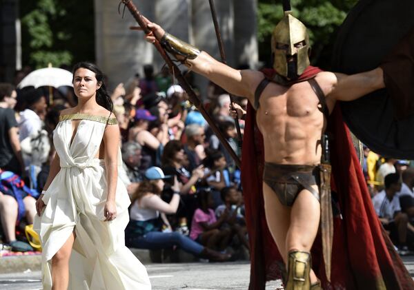 Cosplayers dressed as Queen Gorgo and King Leonidas I, walk down Peachtree Street at the annual Dragon Con Parade on Saturday, Sept. 1, 2018. 