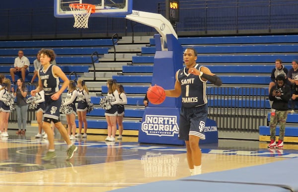 Dwon Odom of the St. Francis Knights takes the ball up the court during their game against the Mount Bethel Eagles at UNG's Convocation Center in Dahlonega on Saturday, March 2, 2019. (Adam Krohn/special)