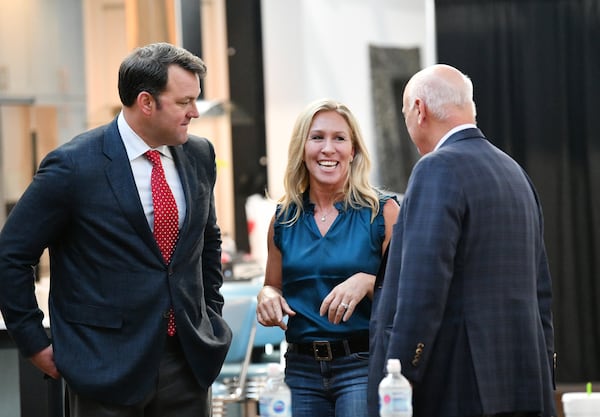 State Sen. Burt Jones, left, shown talking to U.S. Rep. Marjorie Taylor Greene and state Sen. Brandon Beach, featured his endorsement by Donald Trump in ads supporting his campaign for lieutenant governor. But former Cobb County GOP Chair Jason Shepherd said "it was mentioned as a value-add and not the whole reason he was running.” (Hyosub Shin / Hyosub.Shin@ajc.com)