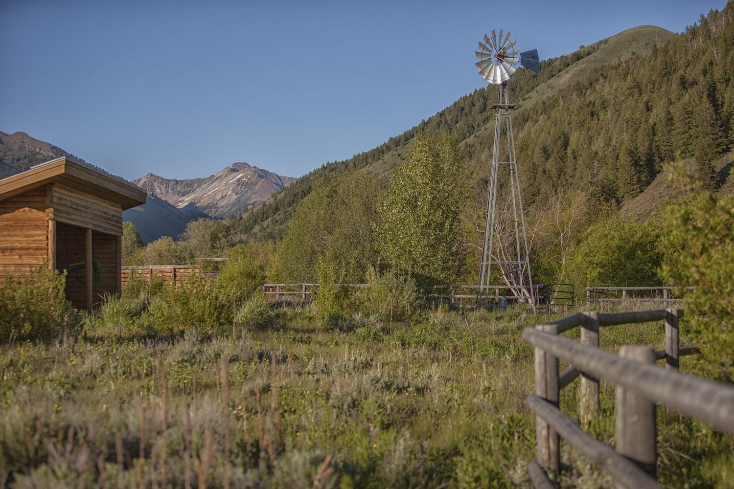 500-acre property has log cabins, mountain views