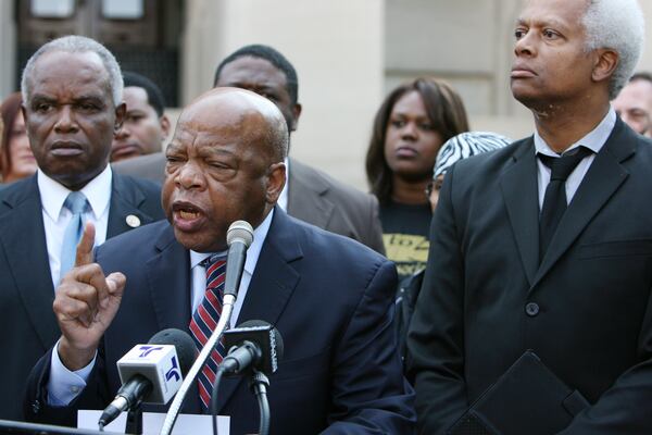 Democratic U.S. Reps. David Scott (L), John Lewis (C) and Hank Johnson (R) in 2012.