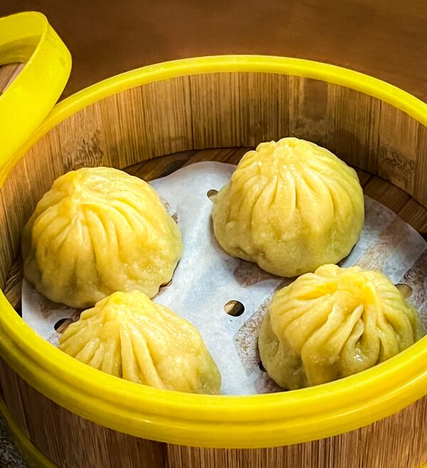 Jiang Nan's already excellent soup dumplings are elevated by the inclusion of black truffle. (Henri Hollis/AJC)