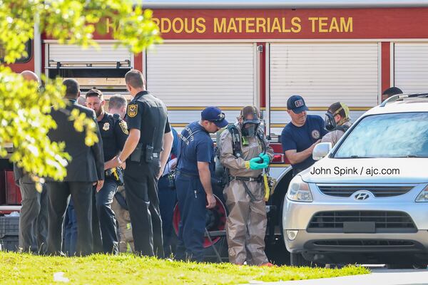 Hazmat crews suit up at the scene of the evacuation Tuesday morning.