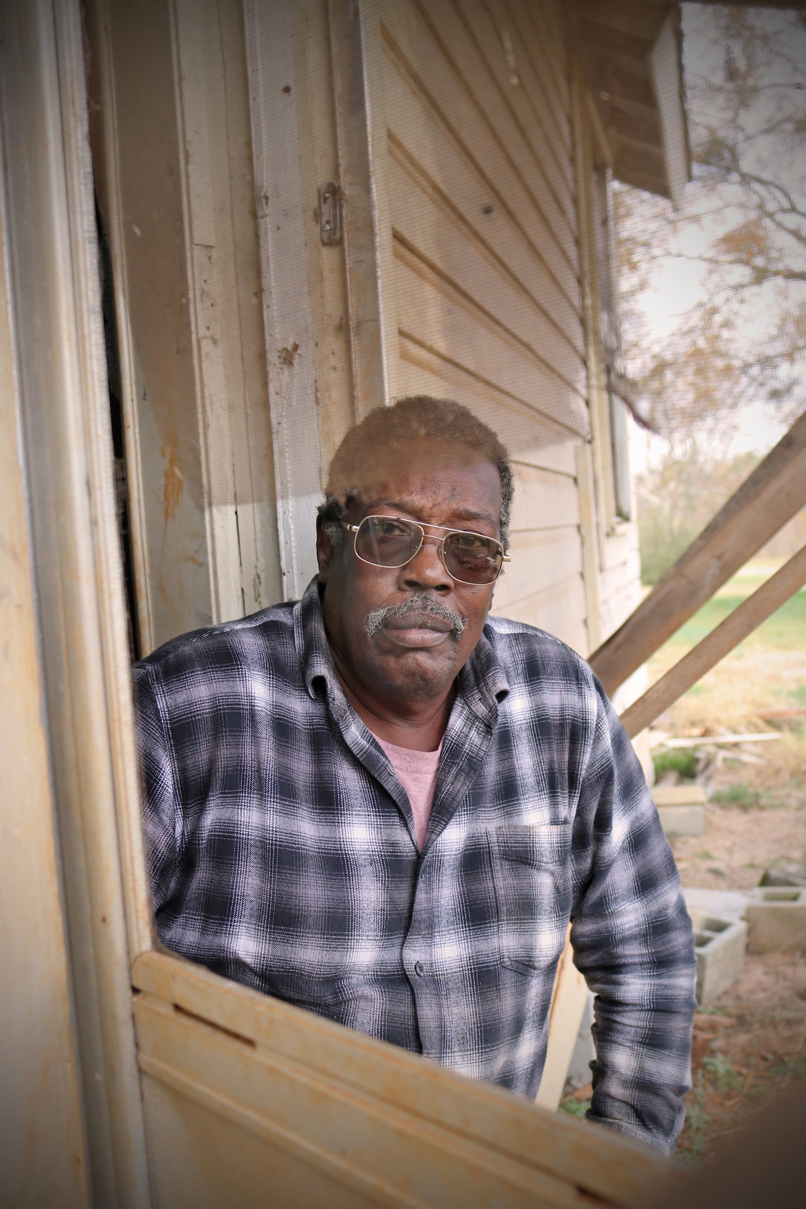 Curtis McDonald in the doorway of a Flint River Farms house.
Courtesy of Eric Dusenbery