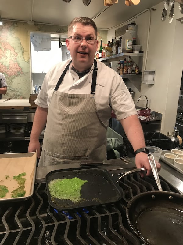 Thomas McKeown prepares basil tuiles for a dessert at the June 7 Georgia Grown dinner at the James Beard House. LIGAYA FIGUERAS / LFIGUERAS@AJC.COM