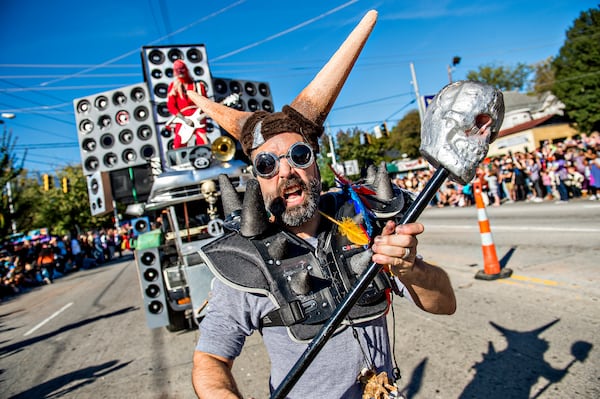 October 17, 2015 Atlanta - Ryan Vila (center) marches down Moreland Ave. during the Little Five Points Halloween Parade in Atlanta on Saturday, October 17, 2015. The annual parade brought out tens of thousands of people to watch the antics. JONATHAN PHILLIPS / SPECIAL