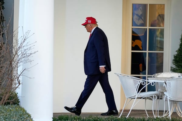 President Donald Trump walks from the Oval Office to depart on Marine One on the South Lawn of the White House in Washington, Friday, Feb. 28, 2025. (AP Photo/Ben Curtis)