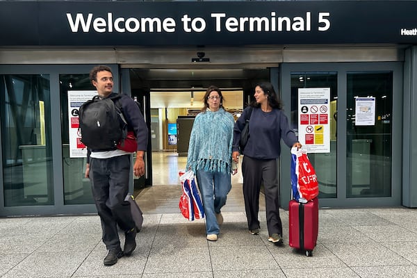 Travellers arrives at Terminal 5 as Heathrow Airport slowly resumes flights after a fire cut power to Europe's busiest airport in London, Saturday, March 22, 2025.(AP Photo/Kirsty Wigglesworth)