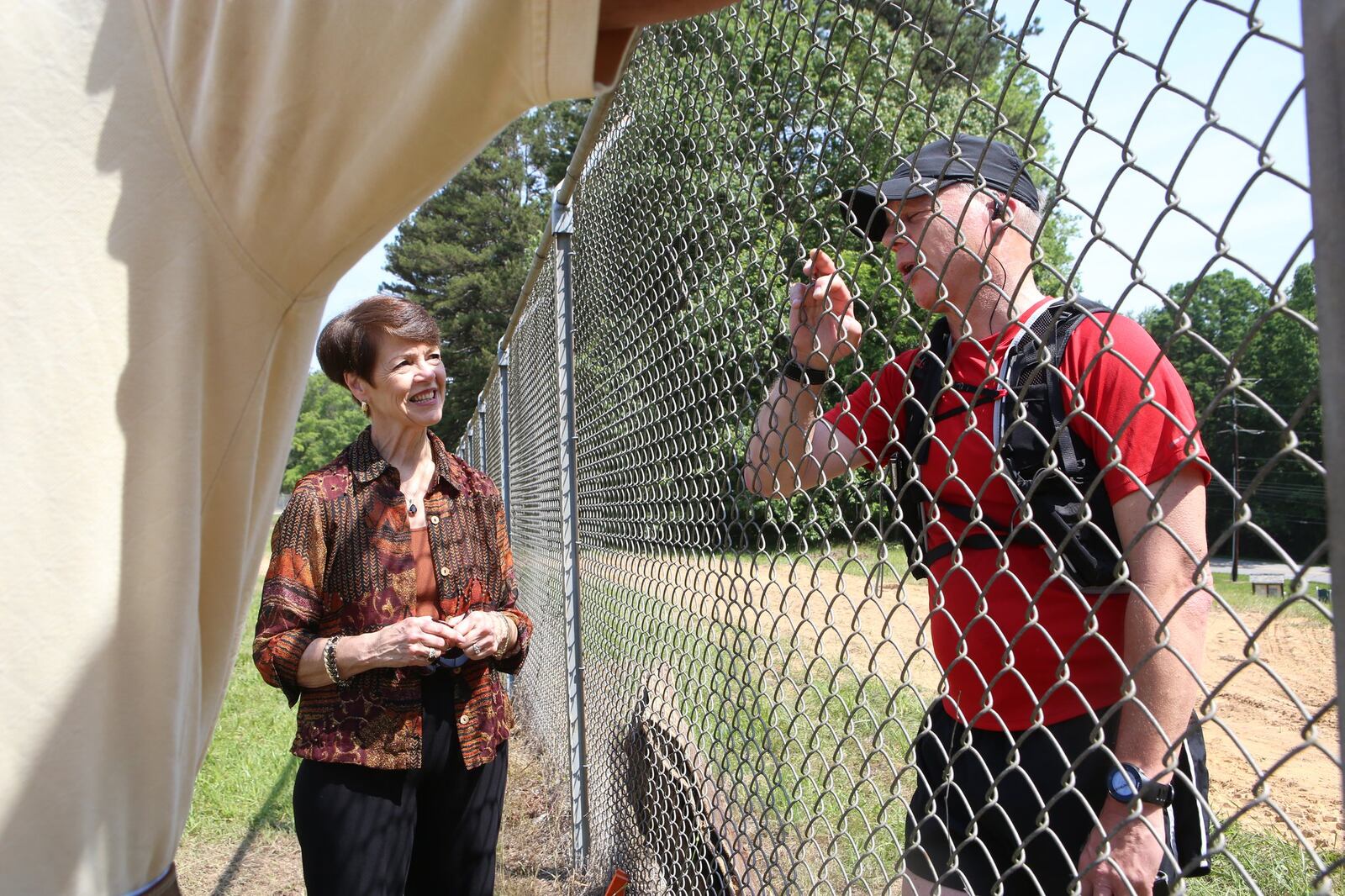 May 19, 2017, Toccoa, Georgia - Cynthia Brown (left) speaks with Flores Hopman after Hopman finished his hike up the mountain outside of Camp Toccoa at Currahee in Toccoa, Georgia, on May 19, 2017. A Holland native from Amsterdam, Hopman visits the camp twice a year, every year, and this will be his 17th time hiking the mountain. After his mother passed away as a result of the second world war, he felt the need to pay his respects to the men of Easy Company that helped free his family by doing the exercise they performed every day. (HENRY TAYLOR / HENRY.TAYLOR@AJC.COM)