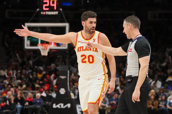 Atlanta Hawks forward Georges Niang (20) talks with official Kevin Scott after Niang was charged a technical foul during the second half against the Orlando Magic at State Farm Arena, Thursday, February, 20, 2025, in Atlanta. The Magic defeated the Hawks 114-108. (Jason Getz / AJC)