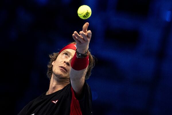 Russia's Andrey Rublev serves to Germany's Alexander Zverev at the ATP Finals tennis tournament in Turin, Italy, Monday, Nov. 11, 2024. (Marco Alpozzi/LaPresse via AP)