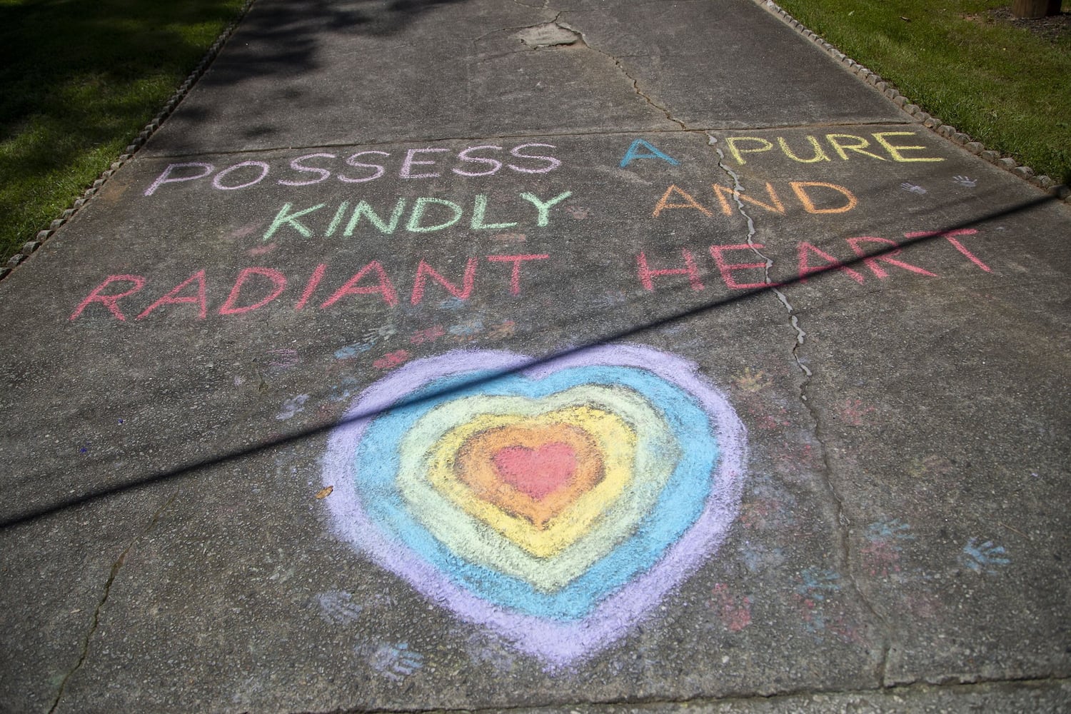 Teacher makes Gwinnett driveway a chalkboard for lessons in caring