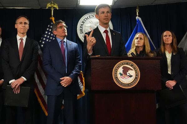 Christopher R. Kavanaugh, the United States Attorney for the Western District of Virginia, gestures while announcing that the McKinsey & Company agreed to pay $650 million for helping Purdue Pharma boost opioid sales during a news conference at the Moakley Federal Courthouse, Friday, Dec. 13, 2024, in Boston. (AP Photo/Charles Krupa)