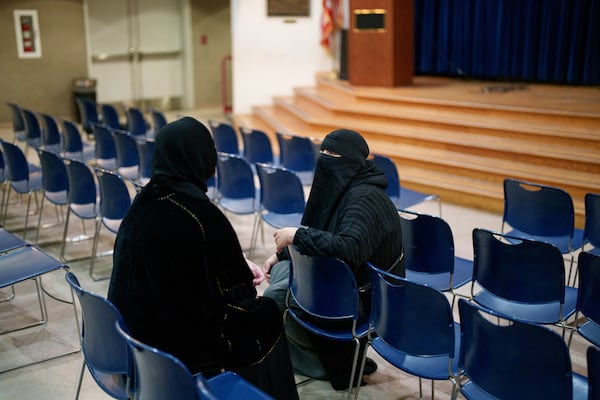 Women talk during a community gathering to discuss plans for Ramadan for members of Masjid Al-Taqwa, held at a school in Pasadena, California, Saturday, Feb. 15, 2025. (AP Photo/Eric Thayer)