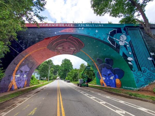 Borders was inspired by the three Fates from Greek mythology for her Ormewood Avenue bridge mural. (Photo by Arthur Rudick)