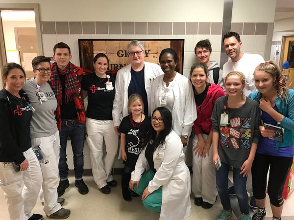  Tom Holland with his new friends at Grady. Photos: Provided to the AJC by Allied Integrated Marketing and used with permission.