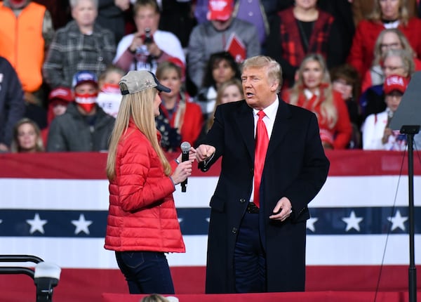 President Donald Trump greets U.S. Sen. Kelly Loeffler at a rally in Valdosta on Dec. 5, 2020.