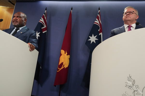 Australian Prime Minister Anthony Albanese, right, and Papua New Guinea Prime Minister James Marape hold a press conference in Sydney, Australia, Thursday, Dec. 12, 2024. (AP Photo/Mark Baker)