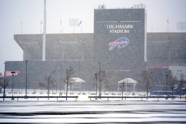 Snow falls on Highmark Stadium and surrounding parking lots in Orchard Park, NY., Saturday, Nov. 30, 2024. The Buffalo Bills play the San Franciso 49ers at Highmark Stadium on Sunday Night Football, Sunday, Dec 1, 2024 at 8:20p. (AP Photo/Gene J. Puskar)