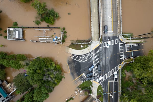 Peachtree Creek spills over its banks at Northside Drive NW in Atlanta on Friday, Sept. 27, 2024 following a night of heavy rain from Hurricane Helene. Ben Gray for the Atlanta Journal-Constitution