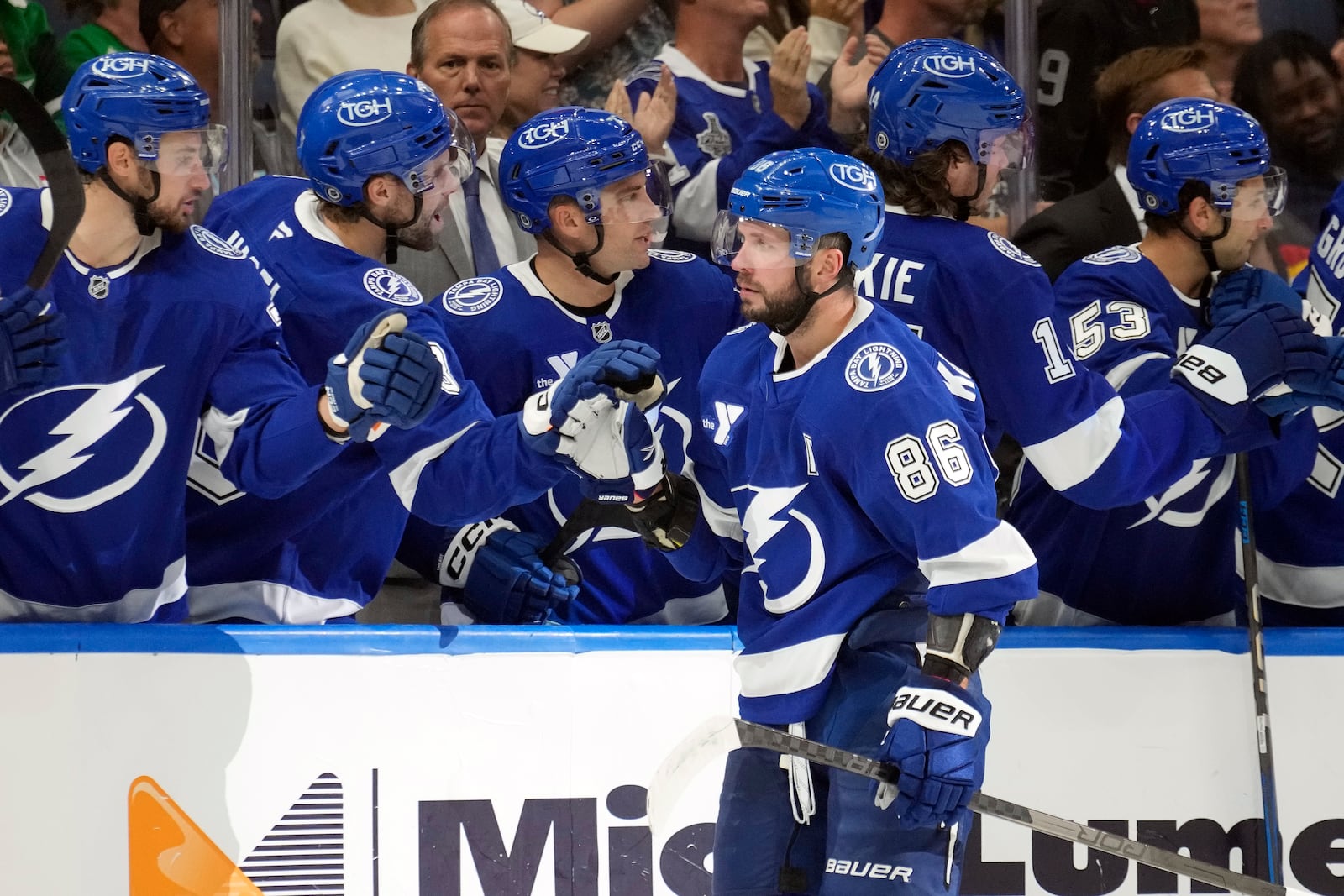 Tampa Bay Lightning right wing Nikita Kucherov (86) celebrates with the bench after his goal against the Florida Panthers during the third period of an NHL preseason hockey game Wednesday, Oct. 2, 2024, in Tampa, Fla. (AP Photo/Chris O'Meara)