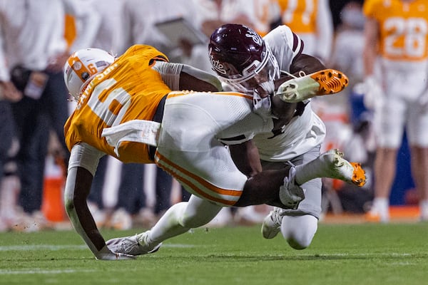 Tennessee running back Dylan Sampson (6) is tackled by Mississippi State cornerback Brice Pollock (14) during the second half of an NCAA college football game Saturday, Nov. 9, 2024, in Knoxville, Tenn. (AP Photo/Wade Payne)