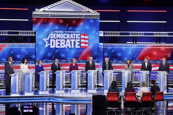 ATLANTA, GEORGIA - NOVEMBER 20: Democratic presidential candidates Sen. Cory Booker (D-NJ),  Rep. Tulsi Gabbard (D-HI) , Sen. Amy Klobuchar (D-MN), South Bend, Indiana Mayor Pete Buttigieg, Sen. Elizabeth Warren (D-MA), Former Vice President Joe Biden, Sen. Bernie Sanders (I-VT), Sen. Kamala Harris (D-CA),  Andrew Yang,  and Tom Steyer participate in the fifth Democratic Presidential Debate at Tyler Perry Studios November 20, 2019 in Atlanta, Georgia. Ten Democratic presidential hopefuls were chosen from the larger field of candidates to participate in the debate hosted by MSNBC and The Washington Post.  (Photo by Alex Wong/Getty Images)