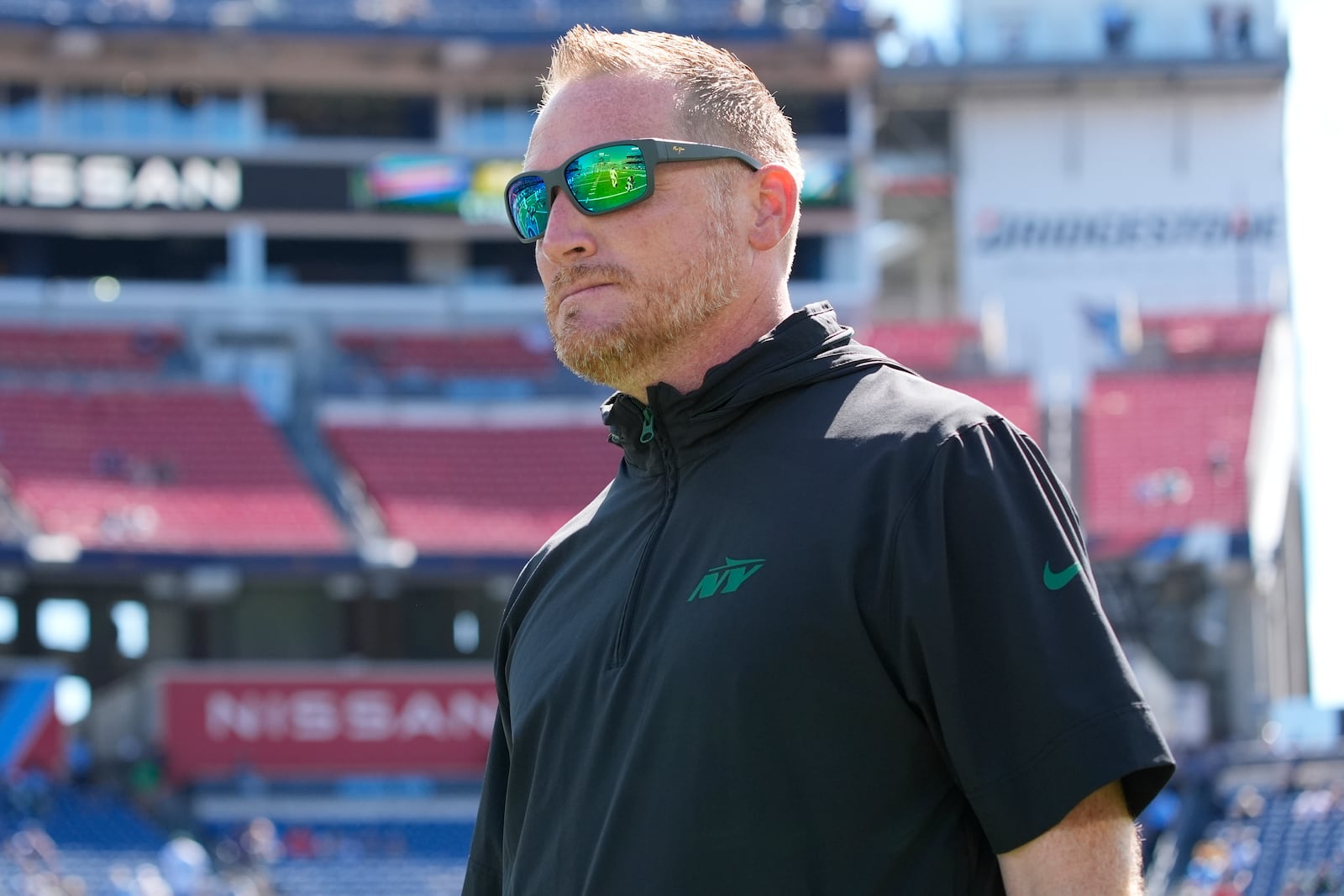 FILE - New York Jets passing game coordinator Todd Downing walks the field before an NFL football game against the Tennessee Titans, Sunday, Sept. 15, 2024, in Nashville, Tenn. (AP Photo/George Walker IV, File)