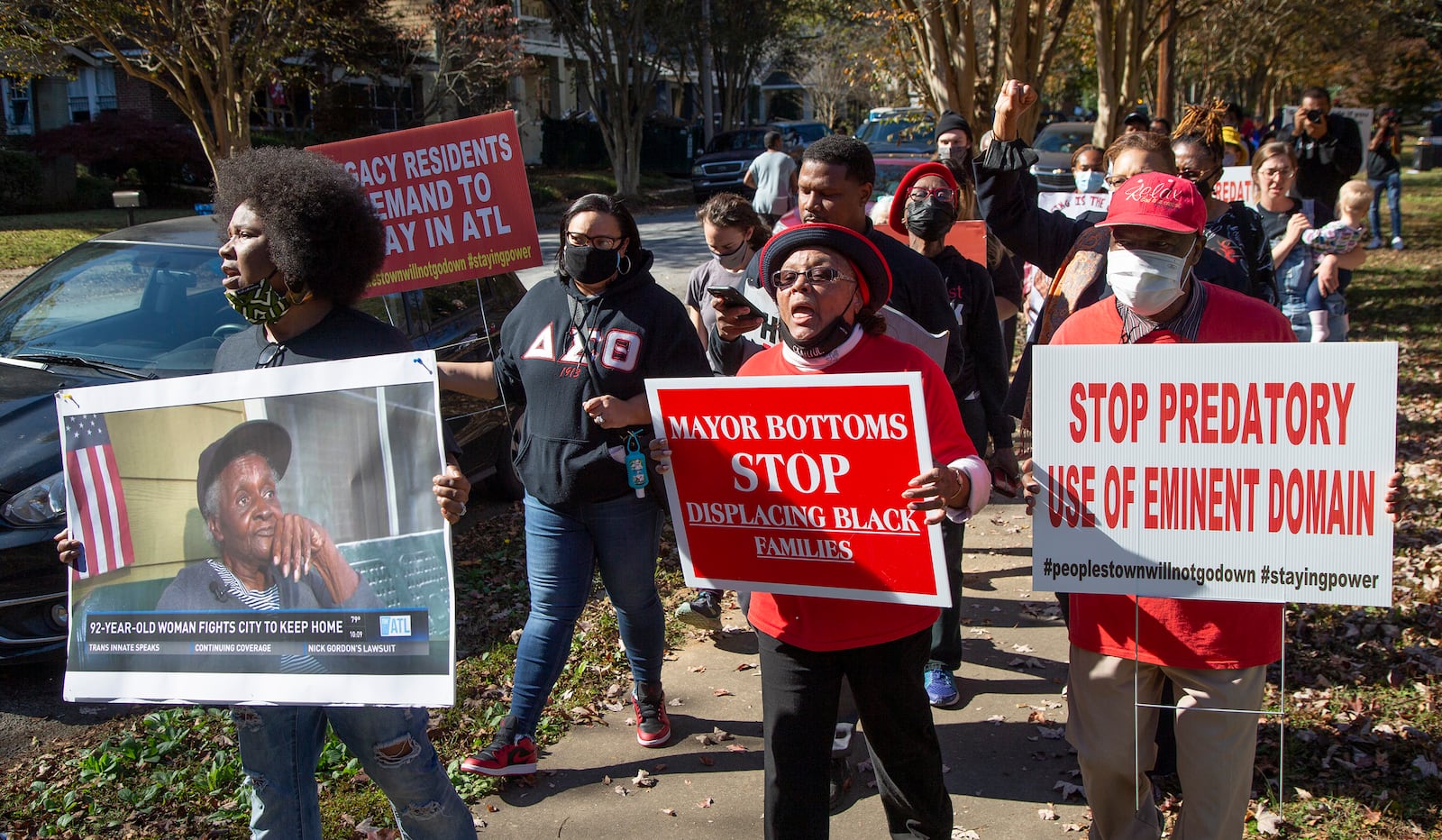 (left to right, front) Tanya Washington Hicks marches the block with Bertha & Robert Darden after an Anti-Election rally where Peoplestown residents are fighting the city of AtlantaÕs year long attempt to take away their homes. The city is trying to do so in order to improve the flood protection conditions in Peoplestown. The two mayoral runoff candidates say they support the people but one of them will ultimately be on the opposing side come January. PHIL SKINNER FOR THE ATANTA JOURNAL-CONSTITUTION