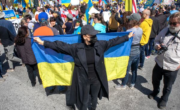 Victoria Tsymbal shows her support along with others for Ukraine during a rally outside Centennial Olympic Park in Atlanta on Saturday, February 26, 2022.  STEVE SCHAEFER FOR THE ATLANTA JOURNAL-CONSTITUTION