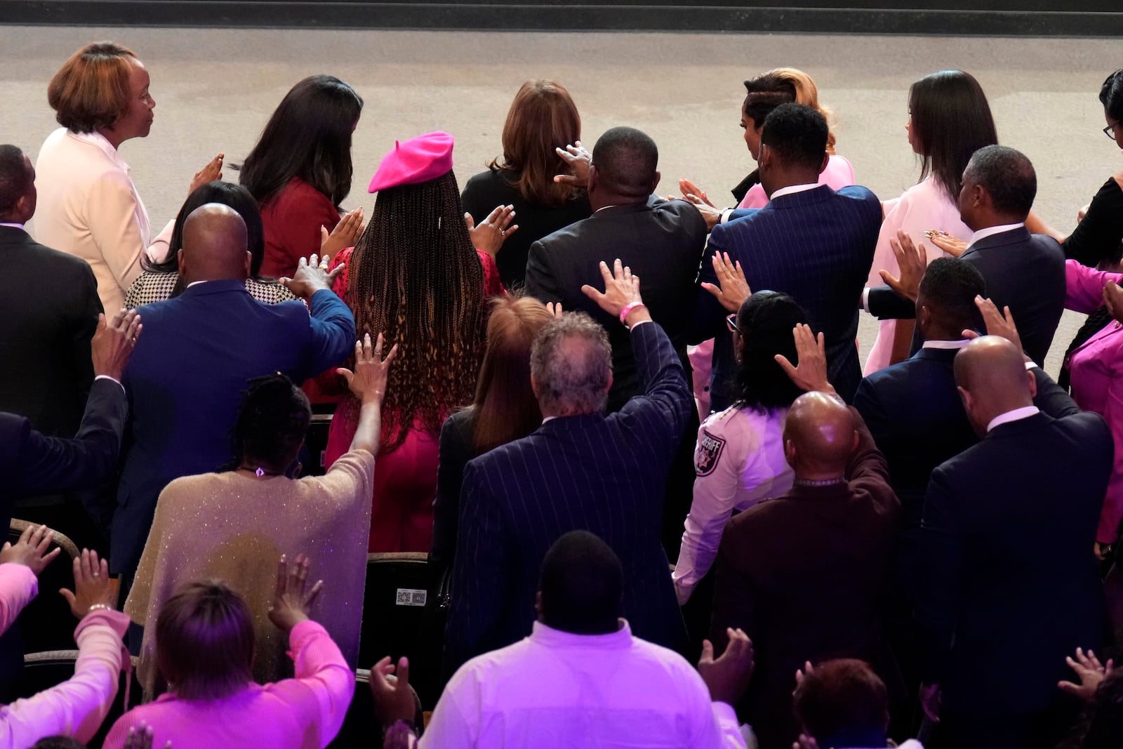 The congregation prays for Democratic presidential nominee Vice President Kamala Harris, top center, at a church service at New Birth Baptist Church in Stonecrest, Ga., Sunday, Oct. 20, 2024. (AP Photo/Jacquelyn Martin)