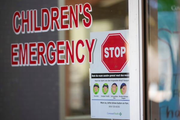 A sign is posted in German at the entrance of the children's emergency room at Covenant Children's Hospital, Tuesday, Feb. 25, 2025, in Lubbock, Texas. (AP Photo/Julio Cortez)