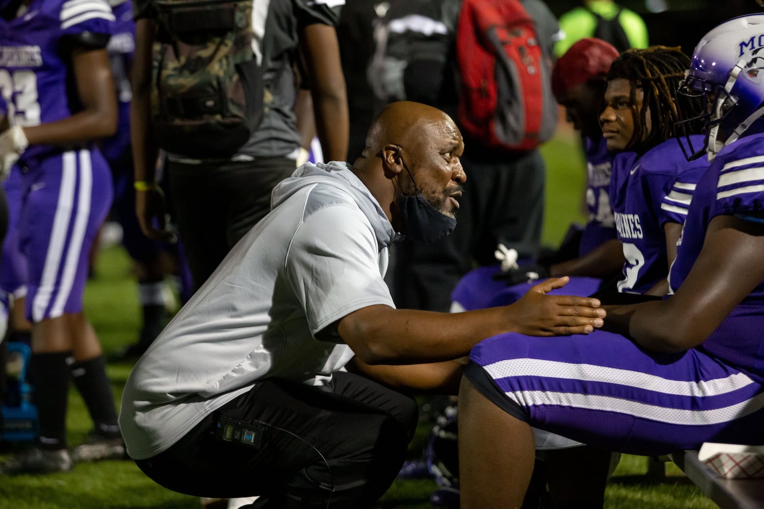 Miller Grove coach Melvin Brown talks with a player during a GHSA high school football game between Stephenson High School and Miller Grove High School at James R. Hallford Stadium in Clarkston, GA., on Friday, Oct. 8, 2021. (Photo/Jenn Finch)