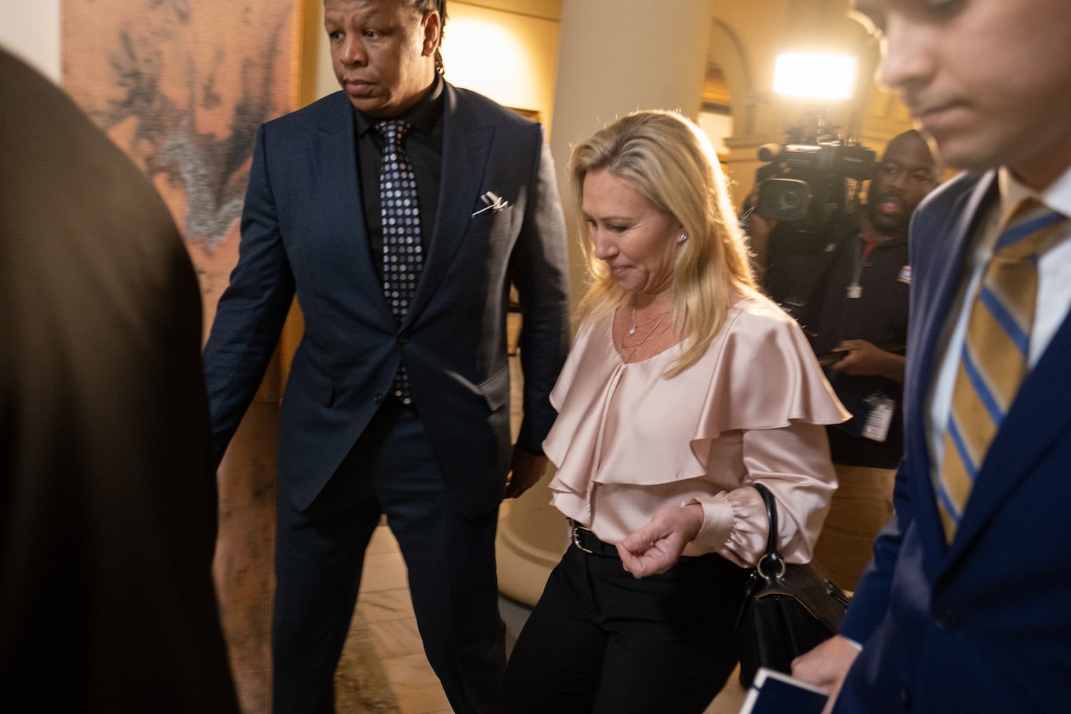 U.S. Rep. Marjorie Taylor Greene leaves the State Capitol after qualifying to run for office on the first day of qualifying Monday, March 7, 2022, at the Georgia State Capitol. (Ben Gray for The Atlanta Journal-Constitution)