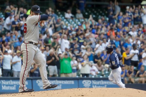 Braves starter Bryse Wilson reacts after giving up a home run to Milwaukee Brewers' Keston Hiura during the second inning of a baseball game Tuesday, July 16, 2019, in Milwaukee. (AP Photo/Morry Gash)