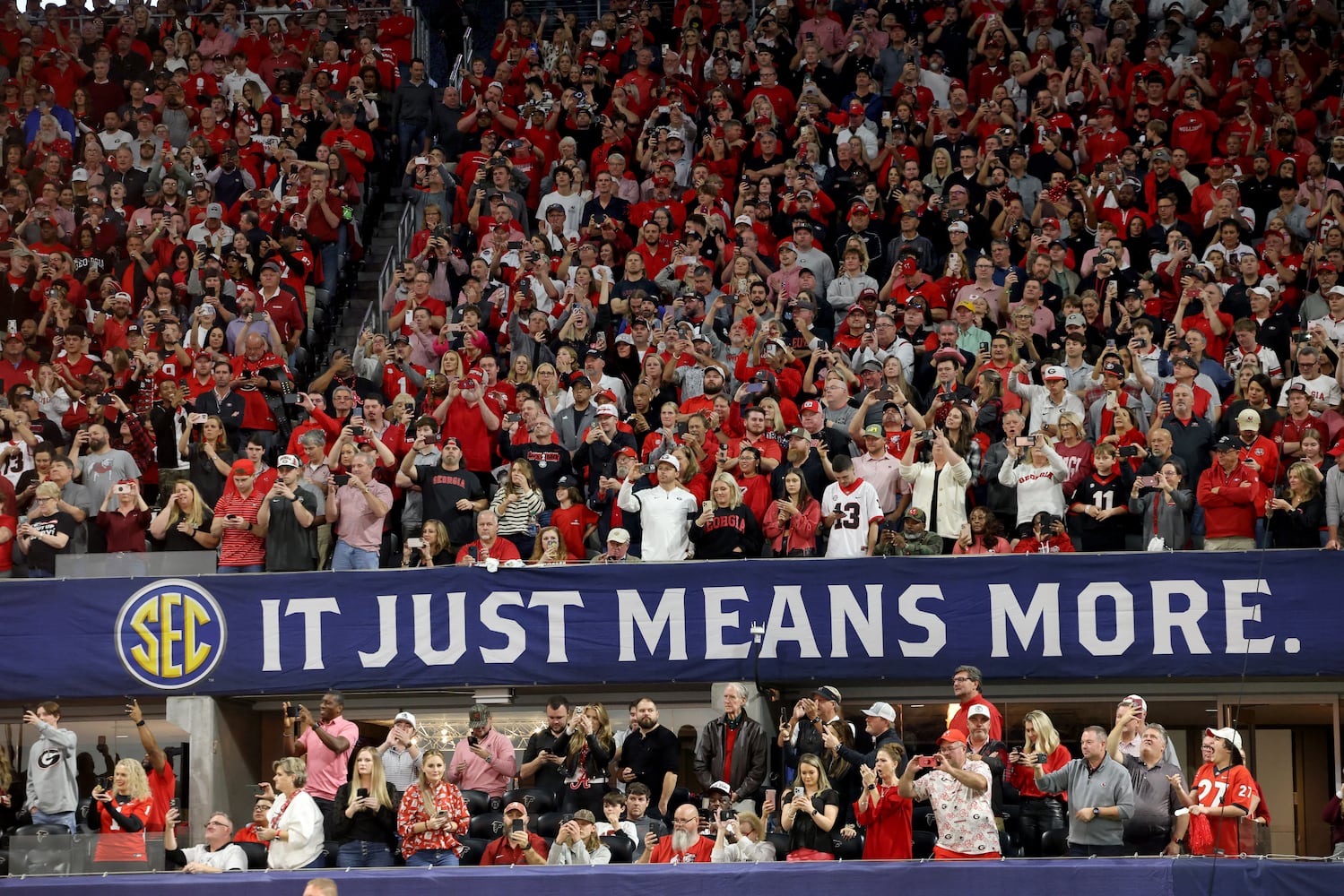 Georgia Bulldogs fans cheer during the first half of the SEC Championship football game at the Mercedes-Benz Stadium in Atlanta, on Saturday, December 2, 2023. (Jason Getz / Jason.Getz@ajc.com)