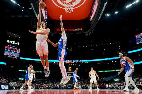 Atlanta Hawks guard Dyson Daniels (5) heads to the basket against the Philadelphia 76ers during the first half of an NBA basketball game, Monday, March 10, 2025, in Atlanta. (AP Photo/Mike Stewart)