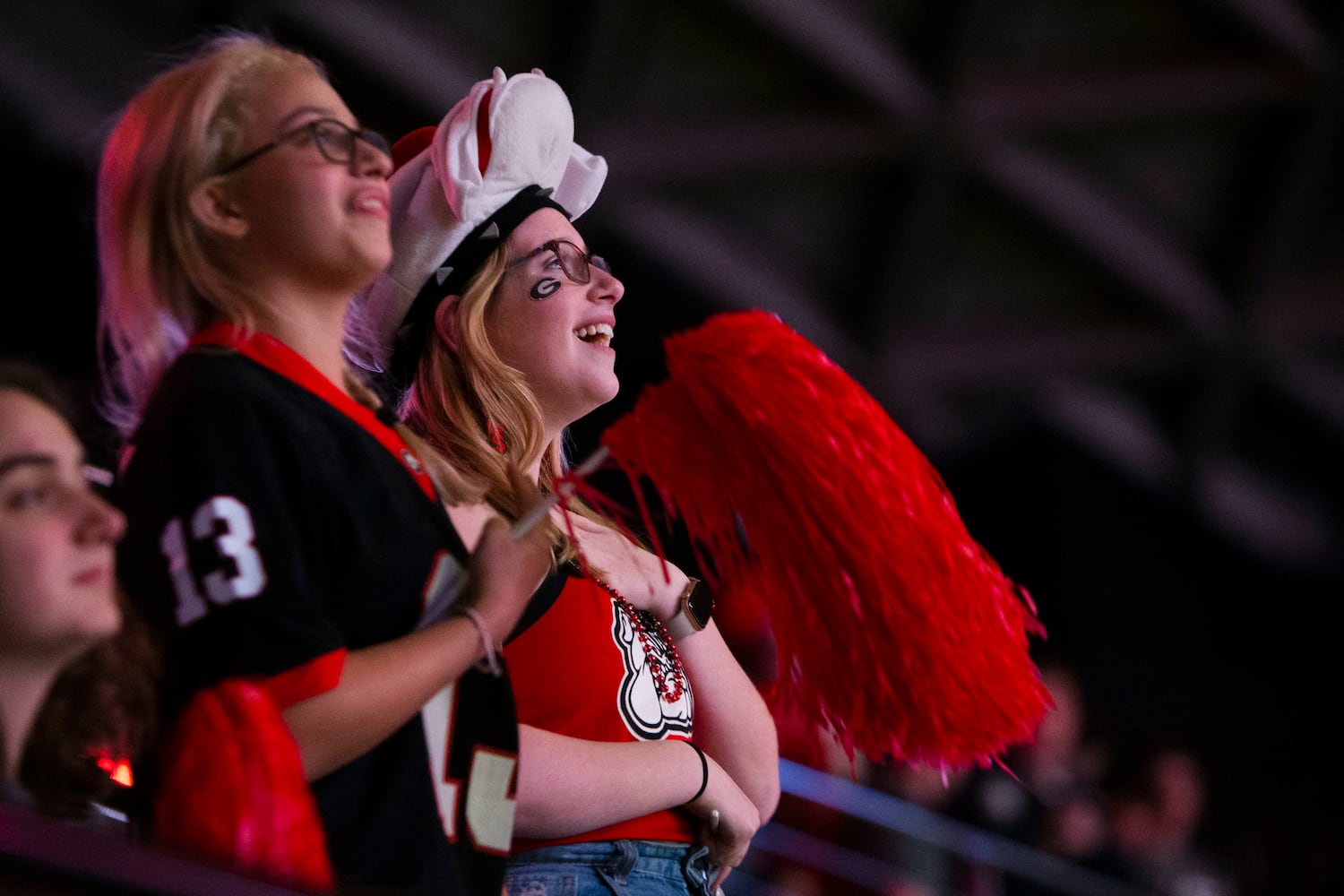 Ainsley Little (right) and Ariana Scarpaci (left) watch the College Football Championship at a watch party on Monday, January 9, 2023, at Stegeman Coliseum in Athens, Georgia. The University of Georgia defeated the Texas Christian University football team 65-7. CHRISTINA MATACOTTA FOR THE ATLANTA JOURNAL-CONSTITUTION.