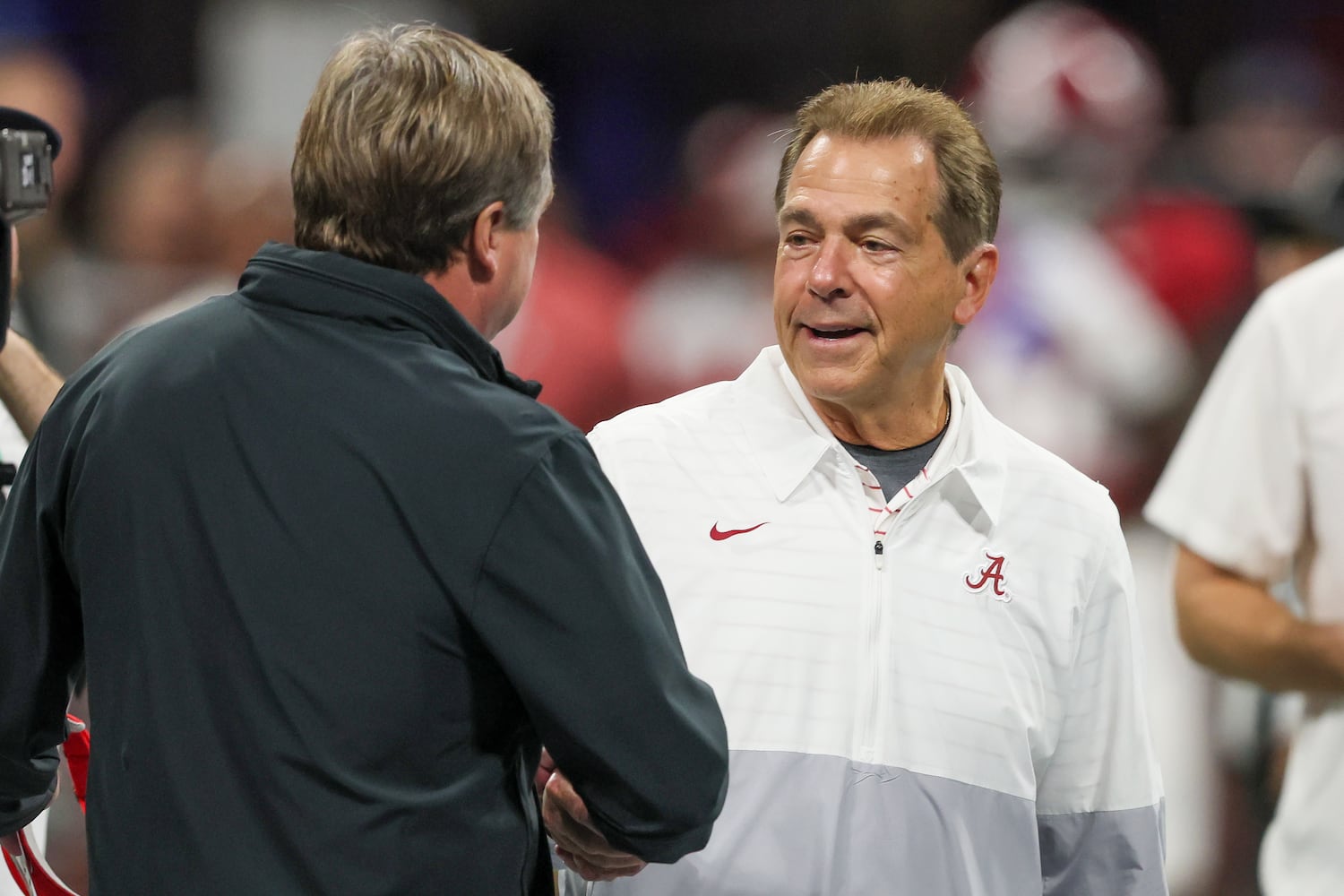 Georgia Bulldogs head coach Kirby Smart and Alabama Crimson Tide head coach Nick Saban get together before the SEC Championship football game at the Mercedes-Benz Stadium in Atlanta, on Saturday, December 2, 2023. (Jason Getz / Jason.Getz@ajc.com)