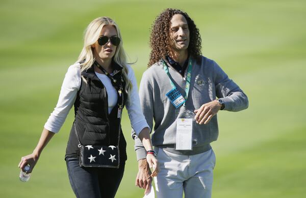 INCHEON CITY, SOUTH KOREA - OCTOBER 09: Paulina Gretzky and musician Kenny G watch the play of the United States Team during the Friday four-ball matches at The Presidents Cup at Jack Nicklaus Golf Club Korea on October 9, 2015 in Songdo IBD, Incheon City, South Korea (Photo by Chung Sung-Jun/Getty Images)