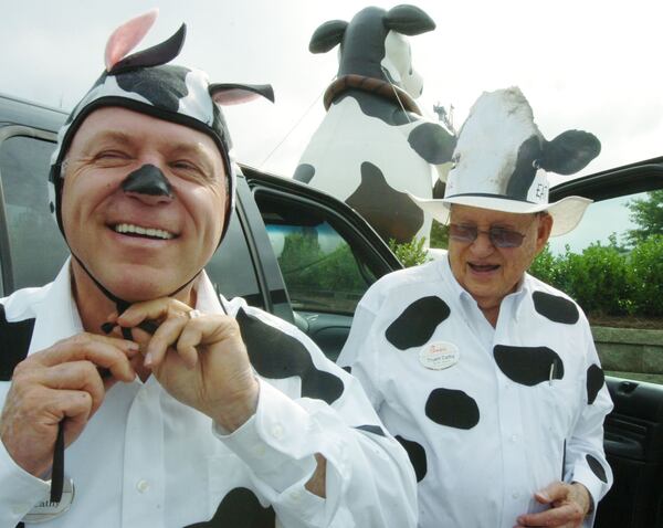 Today is Cow Appreciation Day at Chick-fil-A restaurants. Dan Cathy, left, and his father, Chick-fil-A founder Truett Cathy, are shown in a 2008 photo in their "cow attire" as part of the annual event.