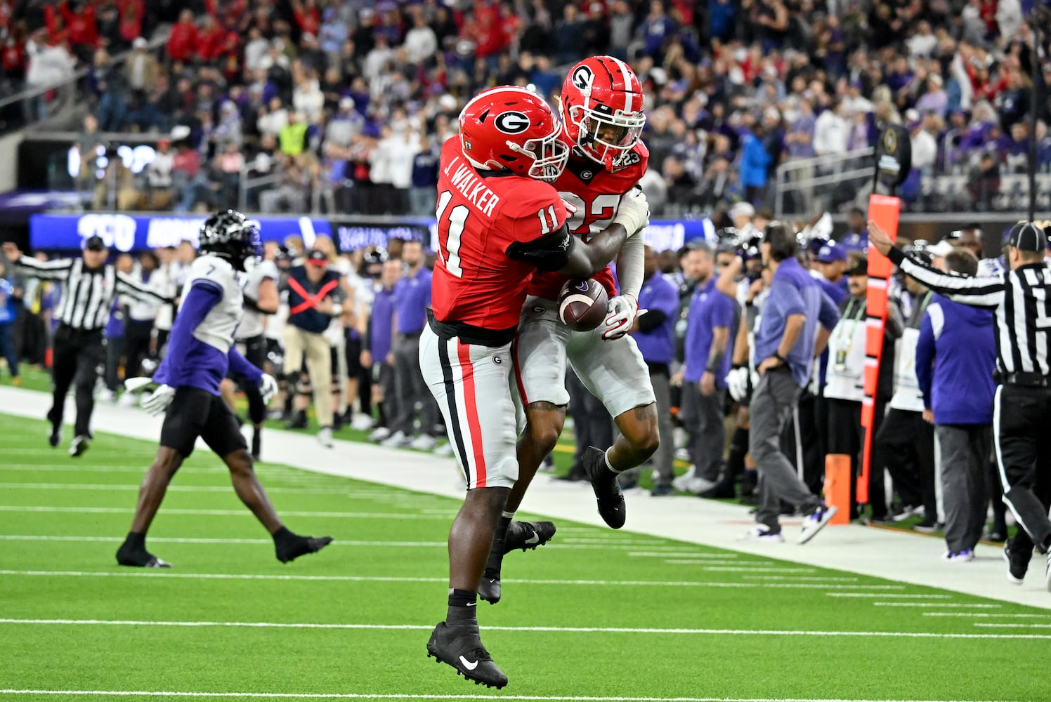 Georgia Bulldogs defensive back Javon Bullard (22) celebrates an interception with Georgia Bulldogs linebacker Jalon Walker (11) during the first half of the College Football Playoff National Championship at SoFi Stadium in Los Angeles on Monday, January 9, 2023. (Hyosub Shin / Hyosub.Shin@ajc.com)