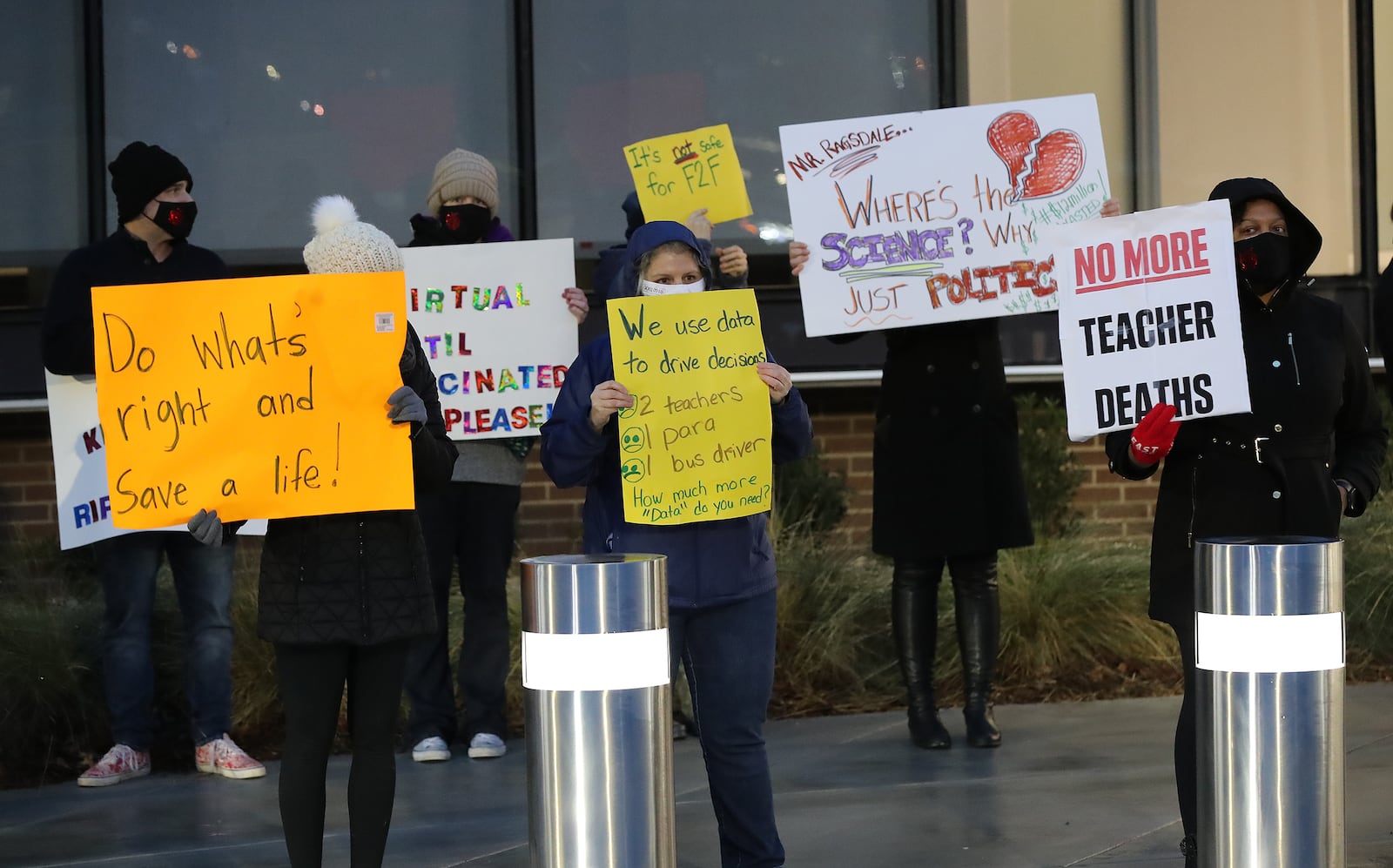 012121 Marietta: Hundreds of Cobb County teachers and staff hold a protest in the parking lot during the school board meeting at the Cobb County School District's Offices on Thursday, Jan. 21, 2021, in Marietta. Cobb teachers are pressing the district for improved COVID-19 response.  Curtis Compton / Curtis.Compton@ajc.com”