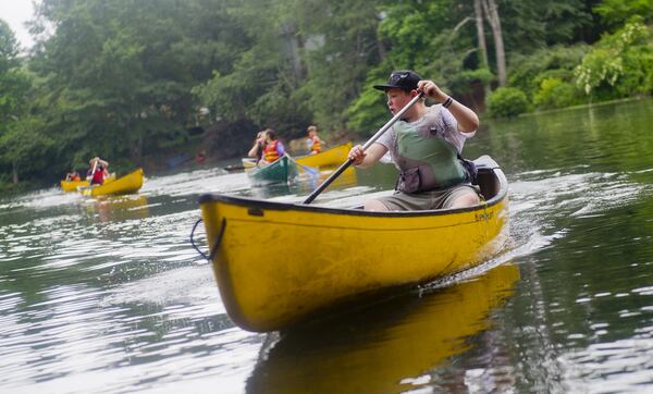 Patrick Fletcher paddles his canoe on one of the three ponds at the Chattahoochee Nature Center in Roswell during Camp Kingfisher. The camp is one of more than 900 in Georgia exempt from state licensing requirements. Its director says it is rigorous on safety measures, hiring only certified lifeguards and canoe instructors. JONATHAN PHILLIPS / SPECIAL