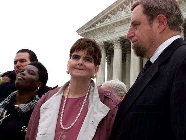 Photo by Rick McKay/Washington Bureau slug: COX-ADA-0422A (This digital image has not been resized. Please do so to meet your specific needs.) WASHINGTON...Lois Curtis, left, and Elaine Wilson, center, talk about their case following arguments before the Supreme Court Wednesday. The two Georgia women are plaintiffs in the Supreme Court case L.C. vs. Olmstead that could decide whether the Americans with Disabilities Act should force states to place mentally disabled patients into community settings, not hospitals. At right is attorney Michael Gottesman. (Photo by Rick McKay/Washington Bureau)