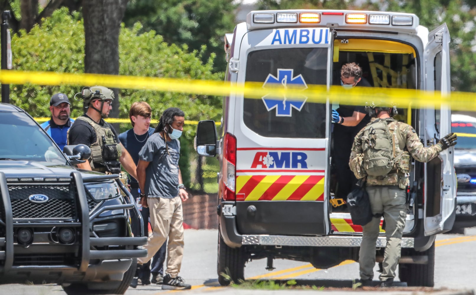 June 14, 2022 Alpharetta: An armed man who was barricaded inside a HomeGoods store in Alpharetta was taken into custody Tuesday June 14, 2022 after a standoff with SWAT. The man allegedly brandished a gun and made threats, prompting evacuations at the store and nearby businesses on North Point Parkway just south of North Point Mall, according to Alpharetta police. He was led out of the building in handcuffs and a medical mask shortly before 1:30 p.m. His name and charges were not released. No shots were fired and no one was reported injured, but REI and Michaels were evacuated as police, fire and SWAT teams made camp in the shopping centerÕs parking lot. ÒWe do have the active scene contained,Ó Alpharetta police Lt. Andrew Splawn told reporters from the scene. ÒIf the public does have a reason to come to Alpharetta, the mall area, they are free to do so, but we do ask them to stay away from HomeGoods and the caution tape area that is defined as the perimeter.Ó
Store employees told Channel 2 Action News that chaos ensued when a voice came over the store loudspeaker telling everyone to ÒrunÓ and Òget out.Ó According to Channel 2, the gunman is a disgruntled former employee. ÒThe manager came out of the office and she just told us, all of us, to run,Ó an unnamed employee told the news station. ÒThe store was open, there was customers in the store, and we ran.Ó Police arrived on scene within two minutes of the first 911 call, Splawn said. He could not confirm if the armed man was connected to the store. It was not a hostage situation, according to Splawn. ÒThere were people taking cover to barricade themselves for safety, but as police officers were sweeping and searching the building, we were able to get everyone out safely,Ó he said. (John Spink / John.Spink@ajc.com)


