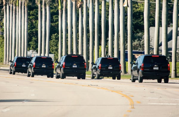 President Donald Trump's motorcade heads to Trump International Golf Club in West Palm Beach Sunday morning, December 31, 2017. (Bruce R. Bennett / The Palm Beach Post)