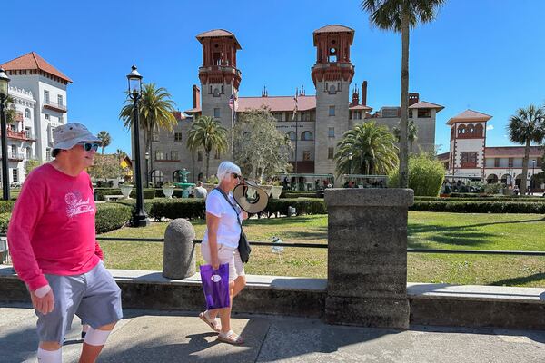 Walkers make their way through the downtown historic district in St. Augustine, Fla., which has become a top remote work hub in the U.S. during the 2020s, on Thursday, March 13, 2025. (AP Photo/Mike Schneider.)