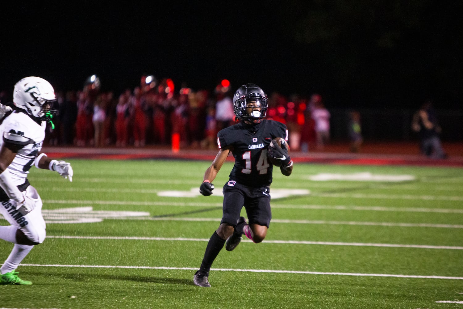 Julian Kendrick, wide receiver for Osborne, makes a catch and runs the ball. CHRISTINA MATACOTTA FOR THE ATLANTA JOURNAL-CONSTITUTION.