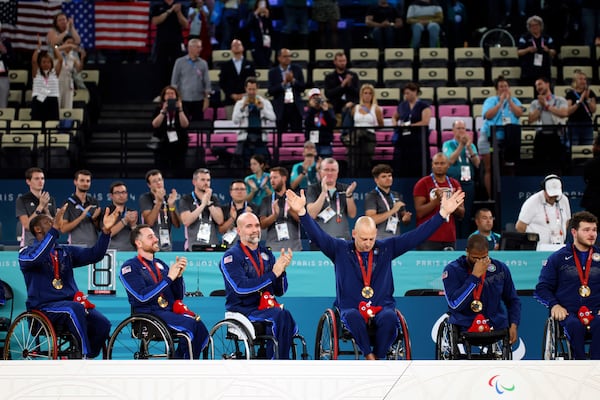 FILE - U.S. players pose with their gold medals after winning the wheelchair basketball men's gold medal match at the 2024 Paralympics, Sept. 7, 2024, in Paris, France. (AP Photo/Thomas Padilla, File)